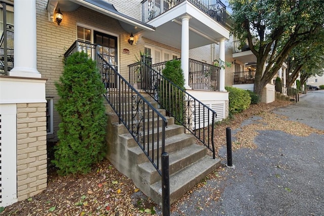 869 Briarcliff Rd NE Unit B20, Atlanta, GA 30306 - entrance to property featuring brick siding, covered porch, and a balcony