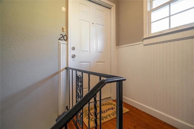 869 Briarcliff Rd NE Unit B20, Atlanta, GA 30306 - stairs featuring wood finished floors, baseboards, and a wainscoted wall