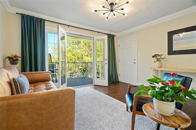 869 Briarcliff Rd NE Unit B20, Atlanta, GA 30306 - living room with ornamental molding, a chandelier, and wood finished floors