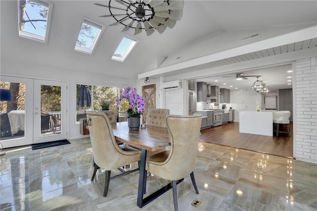 dining area featuring ceiling fan with notable chandelier, lofted ceiling, and a wall mounted AC