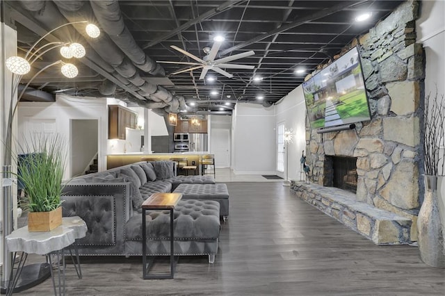 living room featuring dark hardwood / wood-style floors and a fireplace