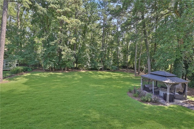 view of yard with a gazebo and outdoor lounge area