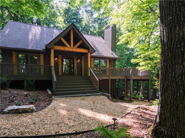 back of property with a wooden deck