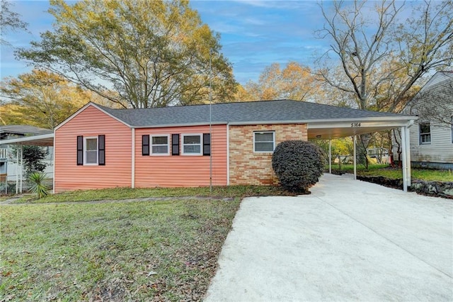 view of property exterior featuring a carport and a yard