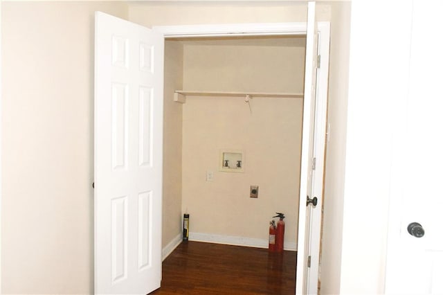 clothes washing area featuring dark hardwood / wood-style floors, hookup for a washing machine, and hookup for an electric dryer