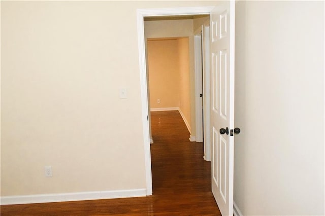 hall with dark wood-type flooring