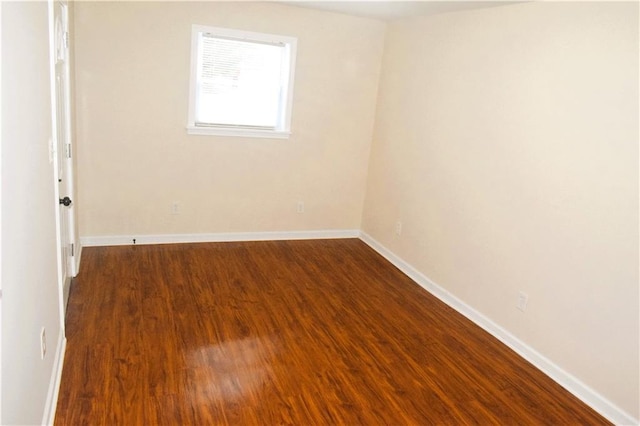 empty room featuring dark hardwood / wood-style floors