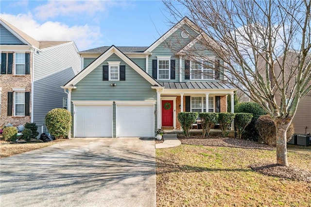 view of front of property featuring a garage, a porch, central AC, and a front yard