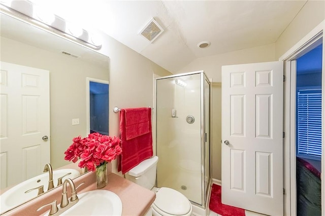 full bathroom featuring a stall shower, visible vents, vanity, and toilet