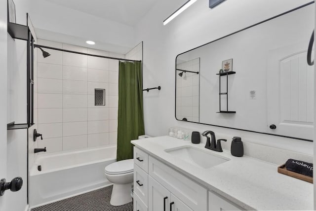 full bath featuring toilet, tile patterned flooring, shower / bath combo, and vanity