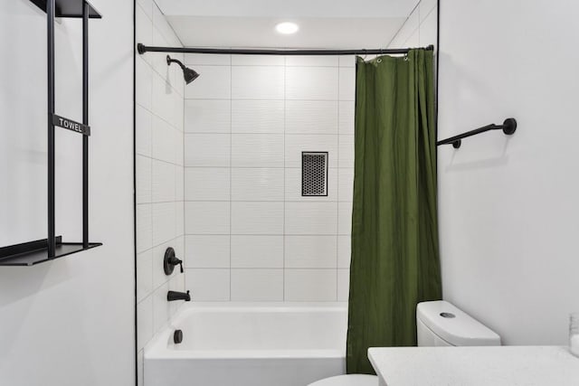 full bathroom featuring toilet, shower / bathtub combination with curtain, and vanity