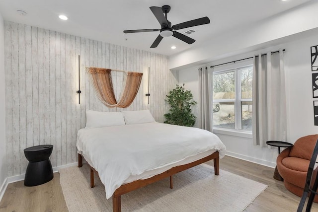 bedroom with baseboards, visible vents, ceiling fan, wood finished floors, and recessed lighting