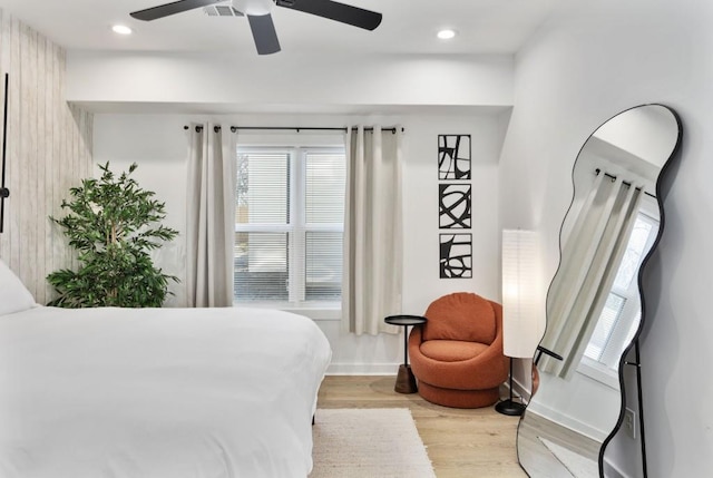 bedroom with light wood-style floors, recessed lighting, baseboards, and a ceiling fan