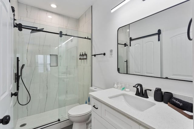 full bath with toilet, a marble finish shower, and vanity