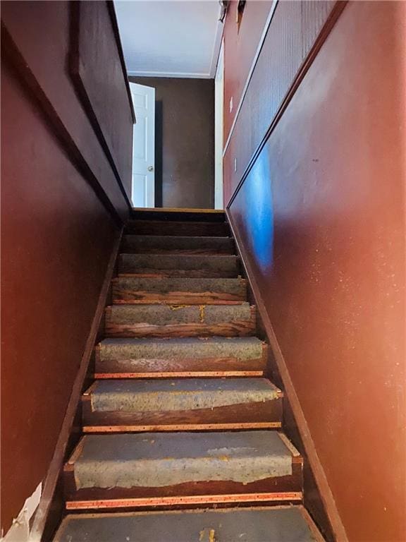 staircase with concrete flooring