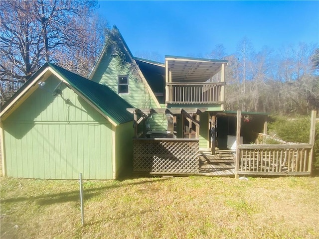 back of house with a lawn