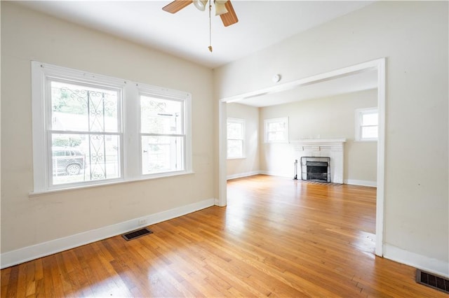 153 Hood Cir, Decatur, GA 30030 - unfurnished living room with a ceiling fan, light wood-style floors, and visible vents