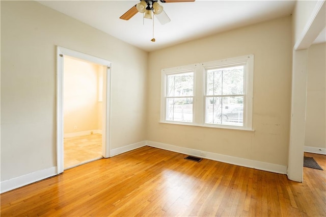 spare room with light hardwood / wood-style floors and ceiling fan