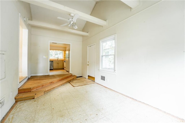 entryway featuring ceiling fan and vaulted ceiling