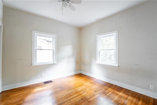 empty room with wood-type flooring and ceiling fan