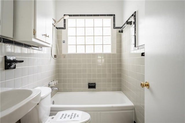 153 Hood Cir, Decatur, GA 30030 - bathroom with tile walls, toilet, a sink, and bathing tub / shower combination