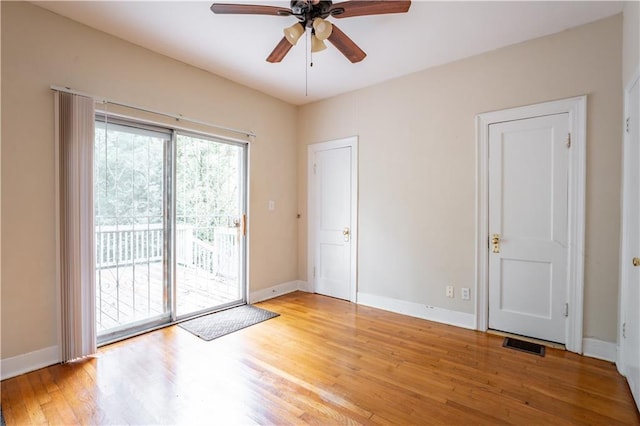 spare room with light hardwood / wood-style floors and ceiling fan