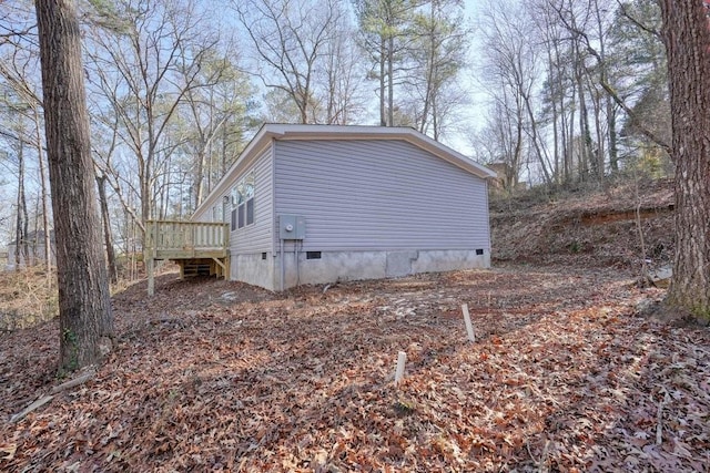 view of side of property with a deck