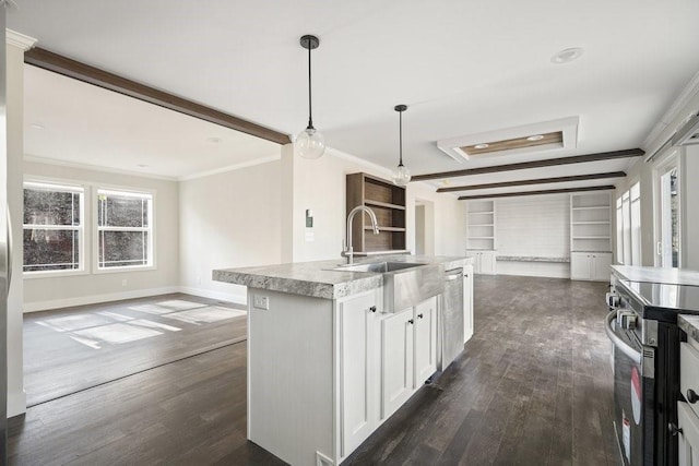 kitchen with decorative light fixtures, appliances with stainless steel finishes, an island with sink, white cabinets, and dark hardwood / wood-style flooring