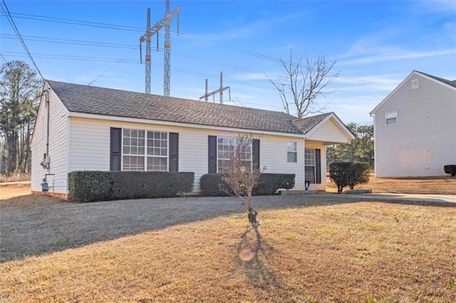 ranch-style house featuring a front lawn