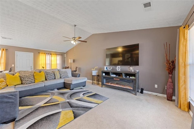 living room with lofted ceiling, carpet floors, and ceiling fan