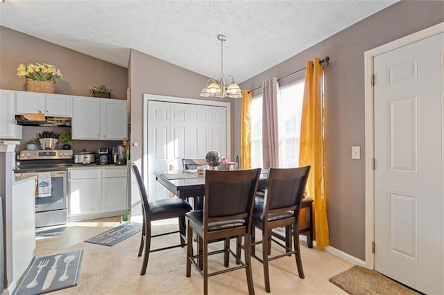 dining space with lofted ceiling, light colored carpet, a notable chandelier, and a textured ceiling