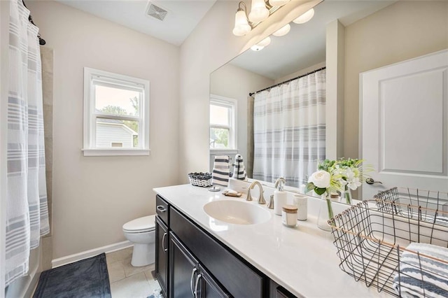 full bathroom featuring tile patterned flooring, vanity, toilet, baseboards, and visible vents