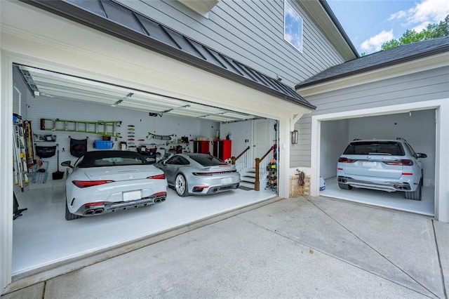garage with concrete driveway