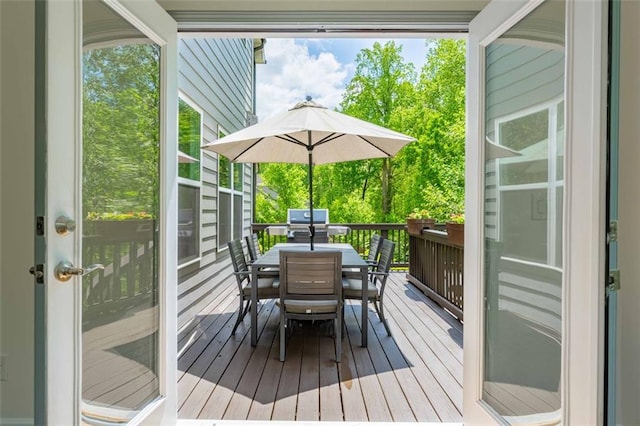 wooden deck with outdoor dining space
