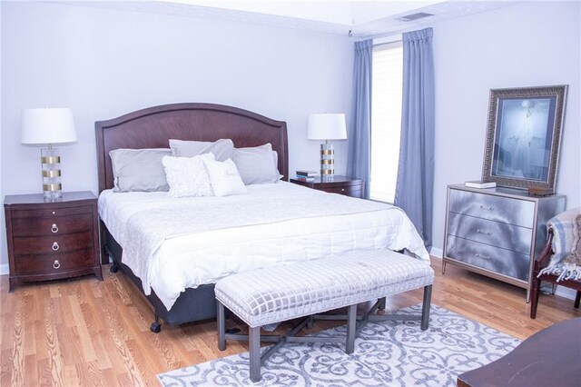 bedroom with light hardwood / wood-style floors