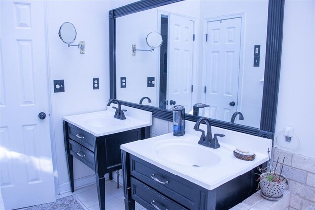 bathroom featuring tile patterned flooring and vanity