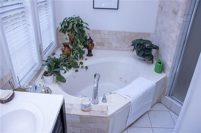 bathroom featuring vanity, tiled bath, and tile patterned floors