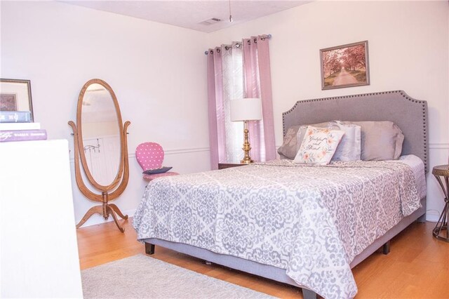 bedroom featuring hardwood / wood-style floors