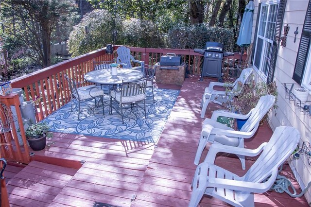 wooden terrace with area for grilling