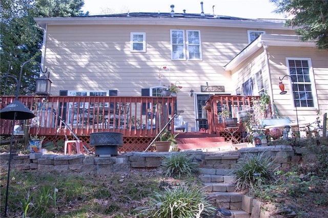 rear view of house with a wooden deck