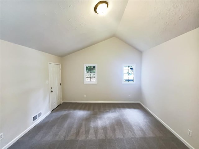4405 Cary Dr, Snellville, GA 30039 - bonus room featuring lofted ceiling, baseboards, and carpet