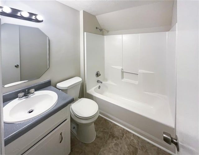 4405 Cary Dr, Snellville, GA 30039 - full bath featuring vaulted ceiling, toilet, vanity, tub / shower combination, and tile patterned flooring