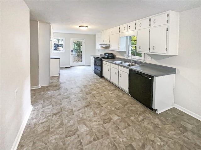 4405 Cary Dr, Snellville, GA 30039 - kitchen featuring black appliances, a sink, baseboards, white cabinets, and under cabinet range hood