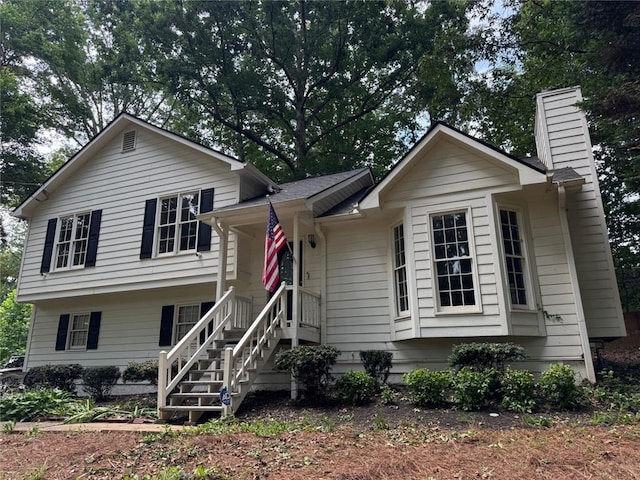 671 Peach Crossing Dr, Dallas, GA 30132 - view of front of house with a chimney