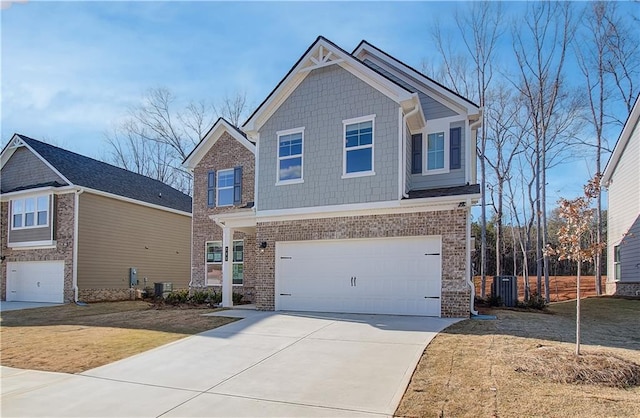 craftsman inspired home featuring a garage, cooling unit, and a front yard