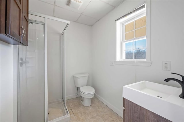 bathroom with toilet, an enclosed shower, a paneled ceiling, and vanity