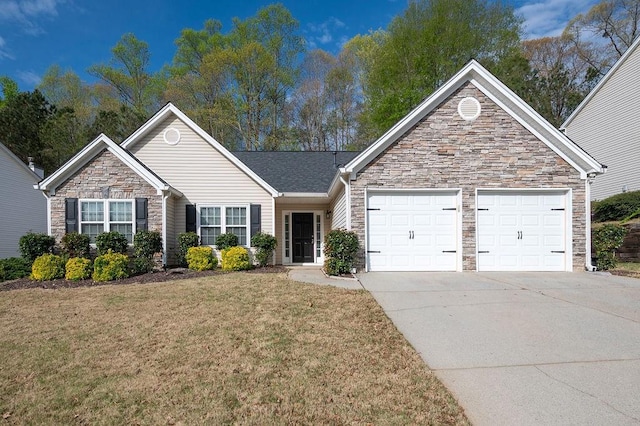 ranch-style home featuring an attached garage, driveway, stone siding, and a front yard