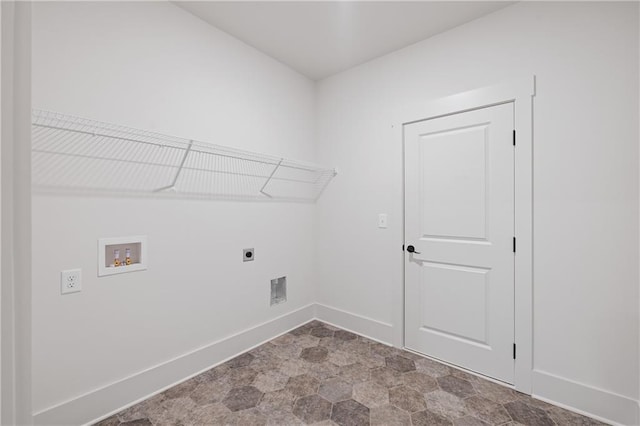 laundry area featuring electric dryer hookup, baseboards, washer hookup, and laundry area