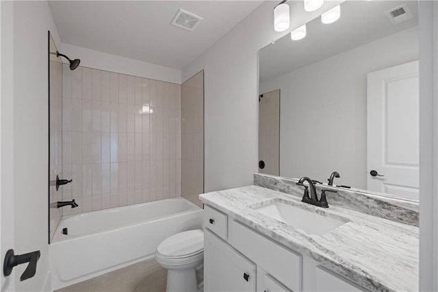 bathroom with vanity, bathing tub / shower combination, toilet, and visible vents