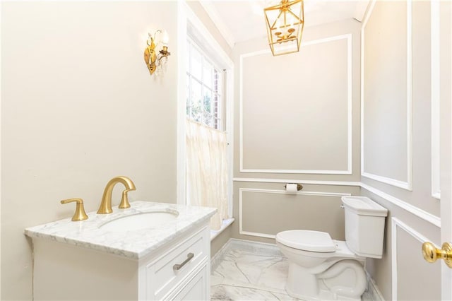 bathroom with vanity and toilet